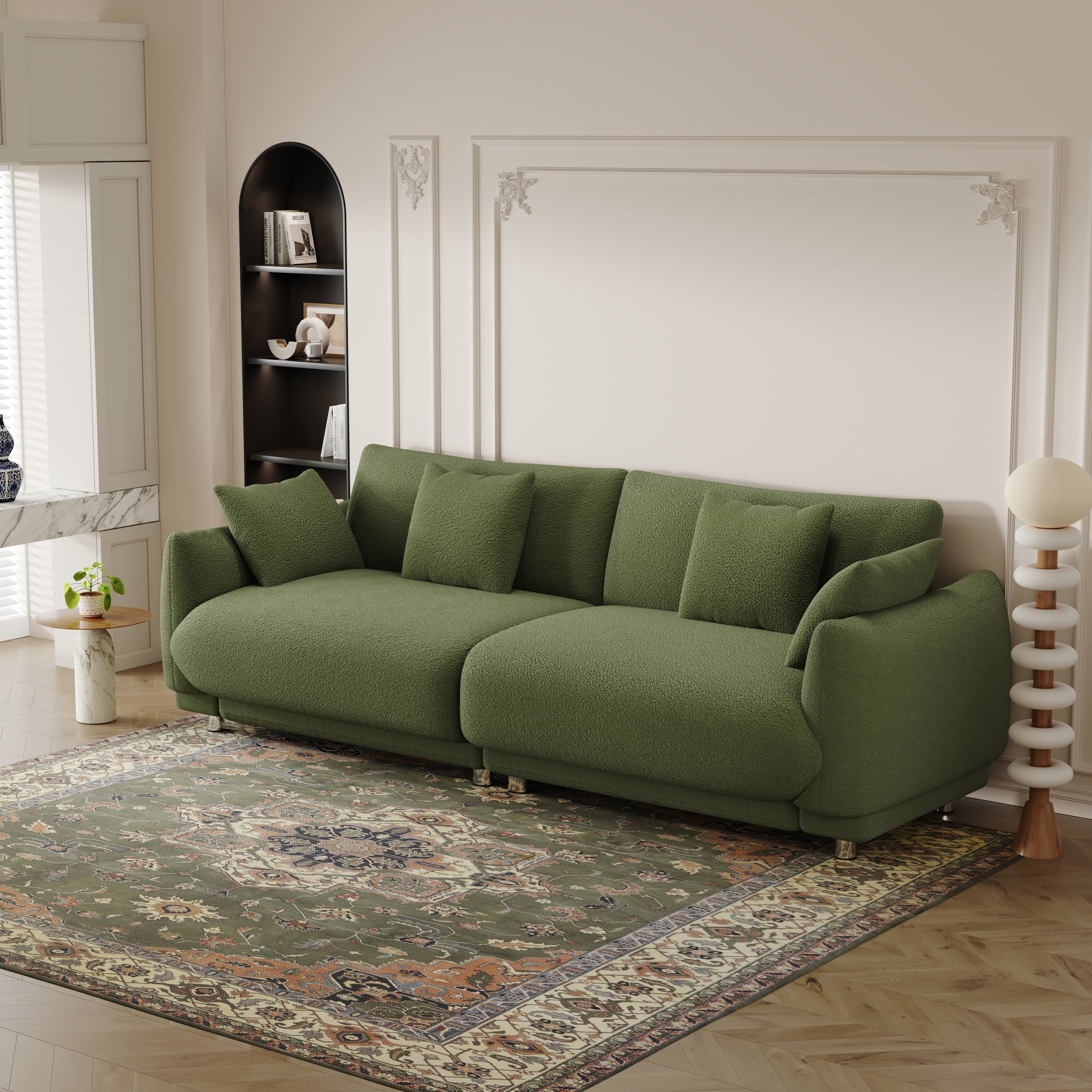 An 86.6-inch teddy wool green sofa with four throw pillows and hardware feet that can sit comfortably in an apartment bedroom wi