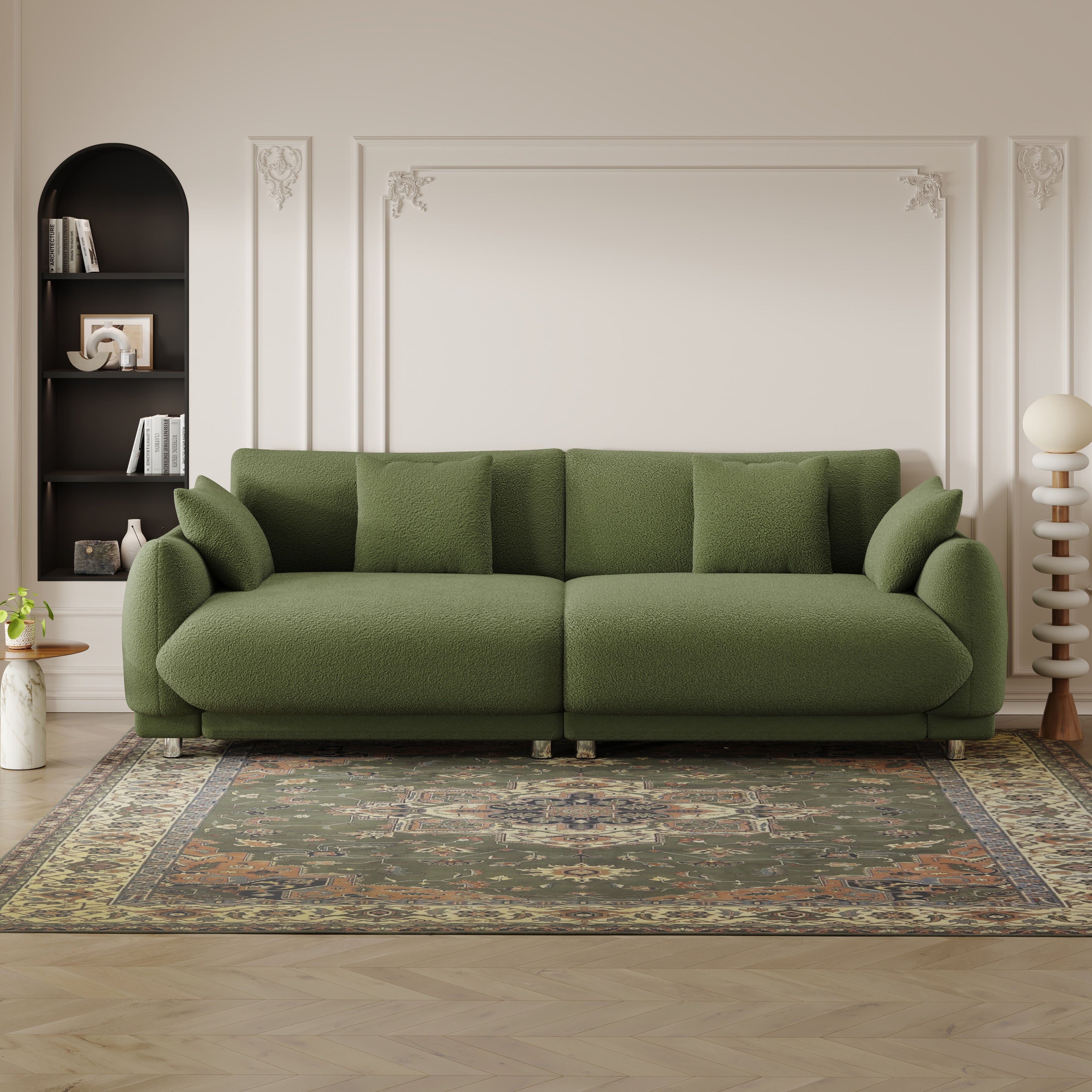 An 86.6-inch teddy wool green sofa with four throw pillows and hardware feet that can sit comfortably in an apartment bedroom wi